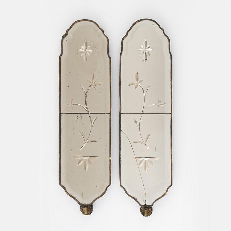 A pair of rococo-style girandole mirrors, early 20th century incorporating older elements.