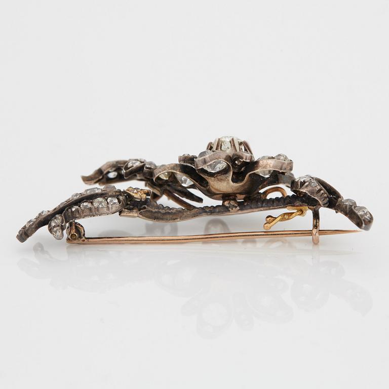 A BROOCH set with old-cut diamonds.