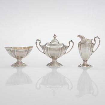 A five-piece sterling silver coffee and tea service, and 12 spoons, USA, first quarter of the 20th century.