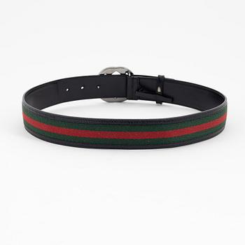 Gucci, a leather and textile belt, size 80.