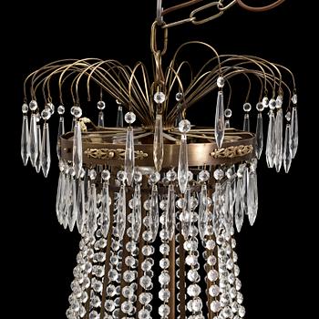 A CHANDELIER, Empire-style, second half of the 20th century.