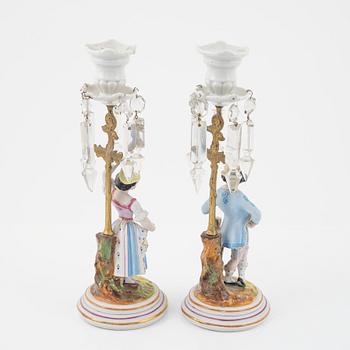 A pair of porcelain Rococo style candlesticks, late 19th Century.