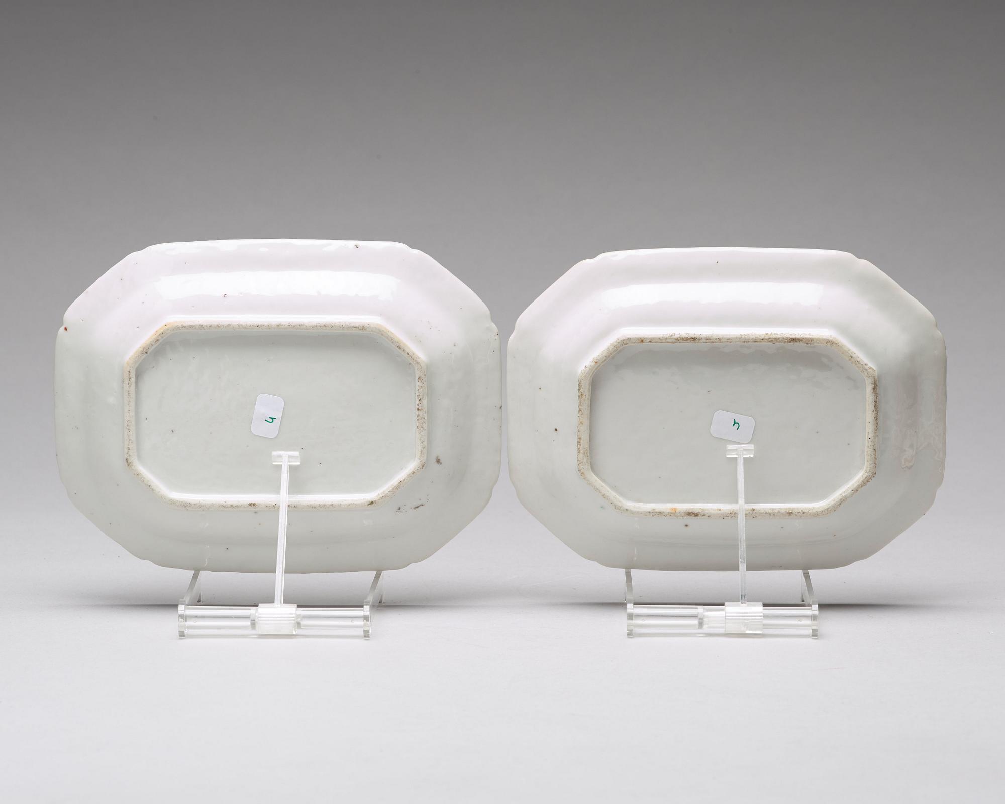 A pair of famille rose 'double peacock' butter tureens with covers and stands, Qing dynasty, Qianlong (1736-95).