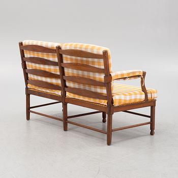 A pair of chairs and a sofa, first half of the 20th Century.