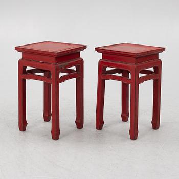 A pair of red Chinese small tables, 20th century.