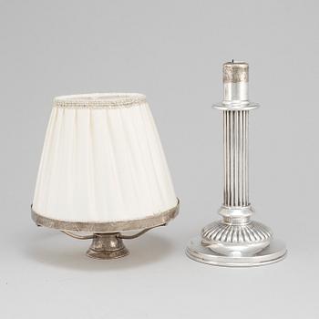 An English 19th century silver candlestick and shade, mark of London 1890.