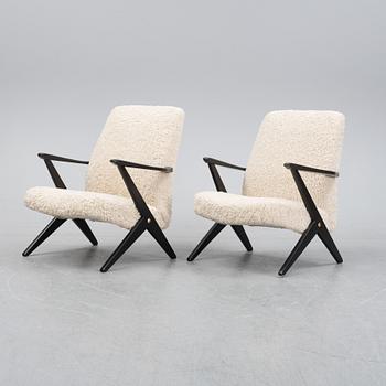 A pair of model 563-037 easy chairs by Bengt Ruda for Nordiska Kompaniet, designed 1952.