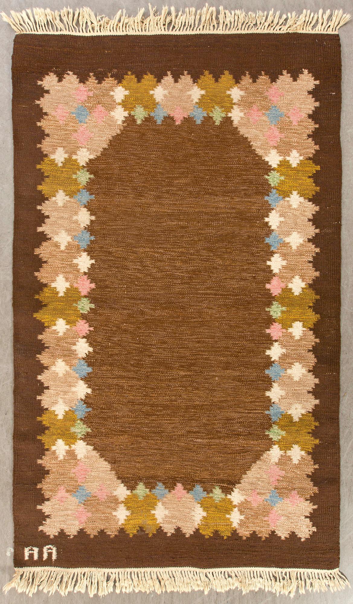 A signed Swedish flatweave carpet ca 207 x 137 cm.