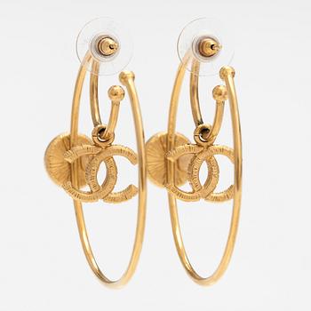 Chanel, A pair of gold coloured metal earrings with palstic pearls. Marked Chanel, A20 C, Made in France.