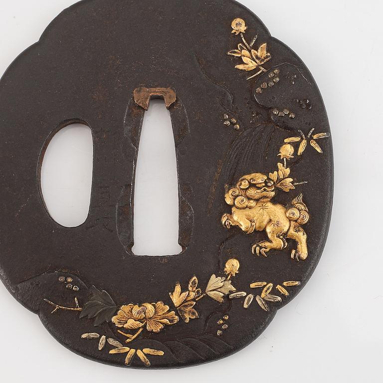 A Japanese iron Tsuba, Edo, 19th century, signed Yanagawa Naomasa.