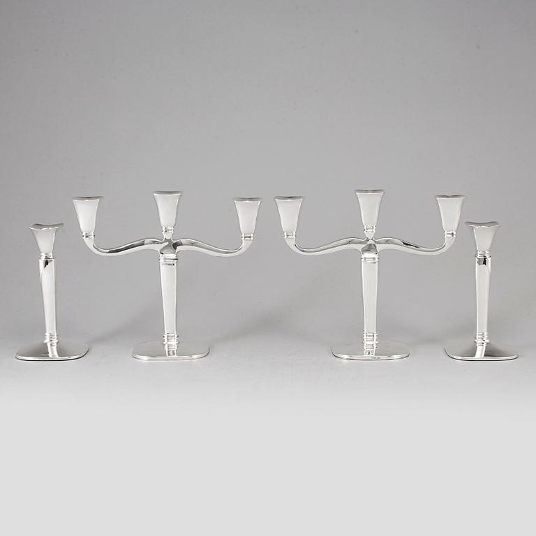 Four (2+2) silver candle holders and candelabras, Germany, 20th century.