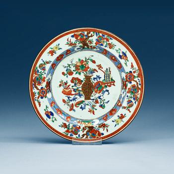 A set of 12 famille rose dinner plates, Qing dynasty, Qianlong (1736-95).