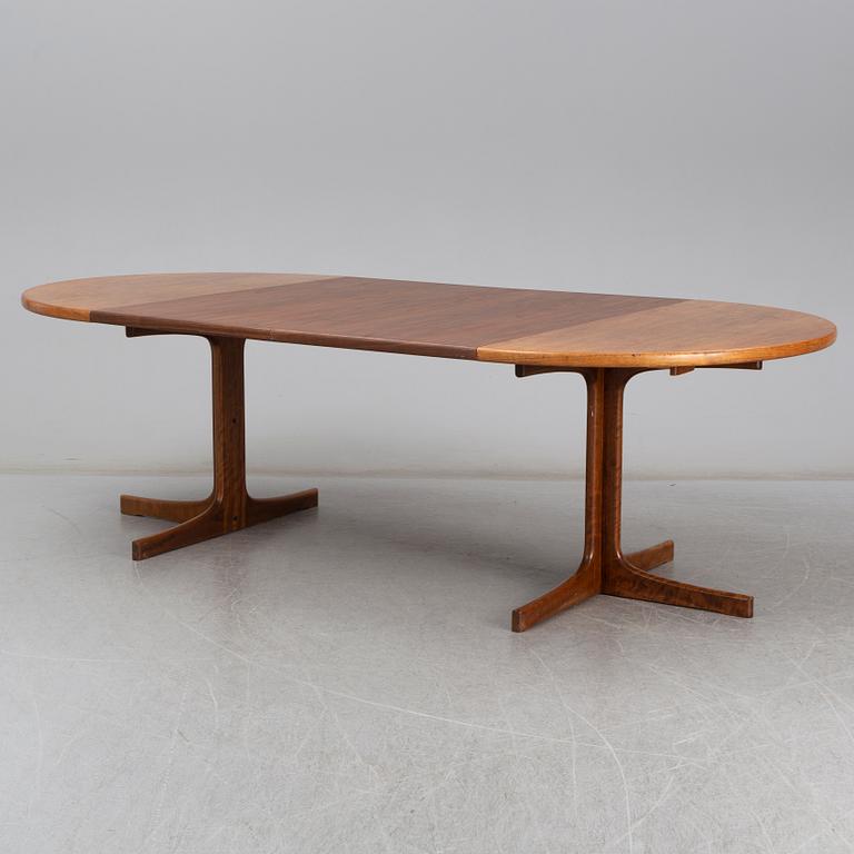A walnut vereered dining table, mid 20th Century.