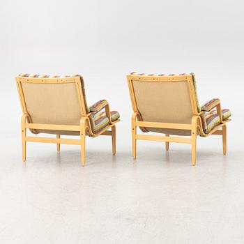 Bruno Mathsson, a pair of "ingrid" armchairs, Dux, Sweden, second half of the 20th century.