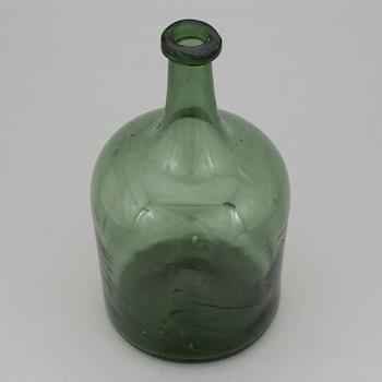 A 18th or 19th century glass bottle.