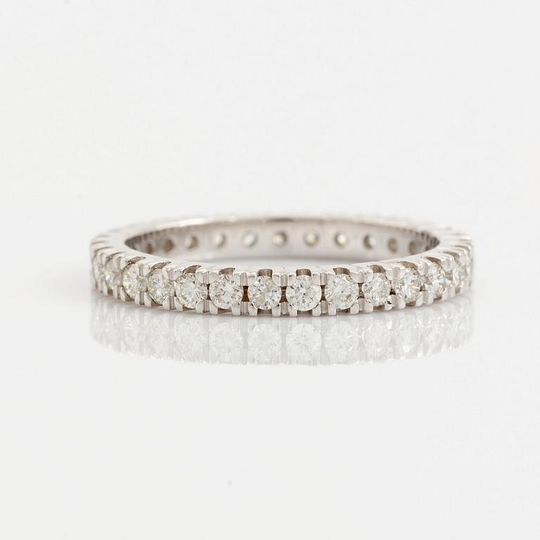 Brilliant cut diamond eternity ring.