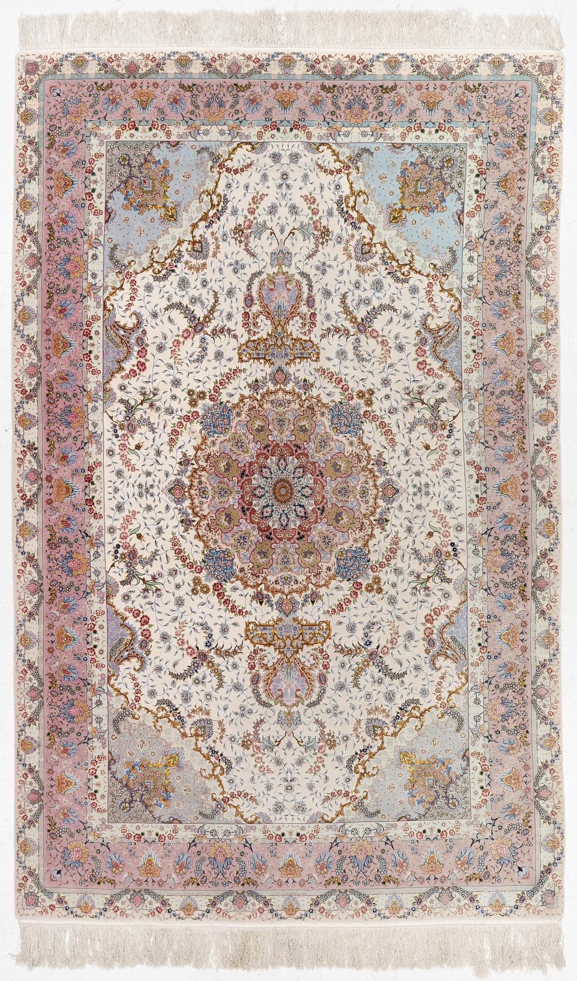 A Tabriz carpet north west Persia, part silk, c. 314 x 197 cm.