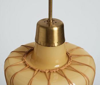 A pair of Swedish Modern vanilla coloured glass ceiling lights with fretted rattan, 1930-40's.