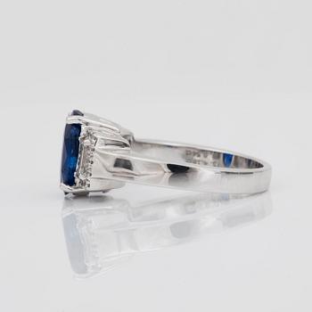 A 4.18 ct sapphire and 0.54 ct diamond ring.