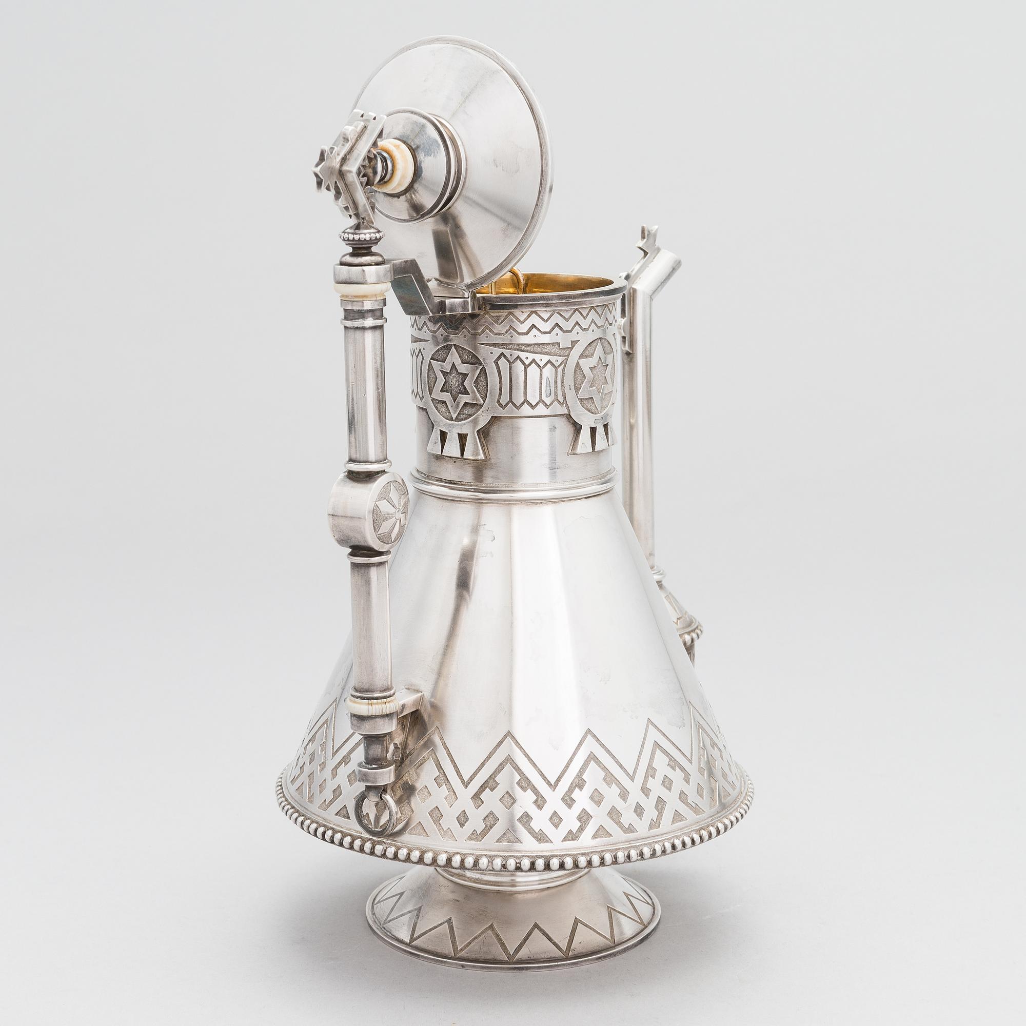 A Russian silver coffee pot, Saint Petersburg 1875, presumably maker's mark of Pyotr Ivanov.