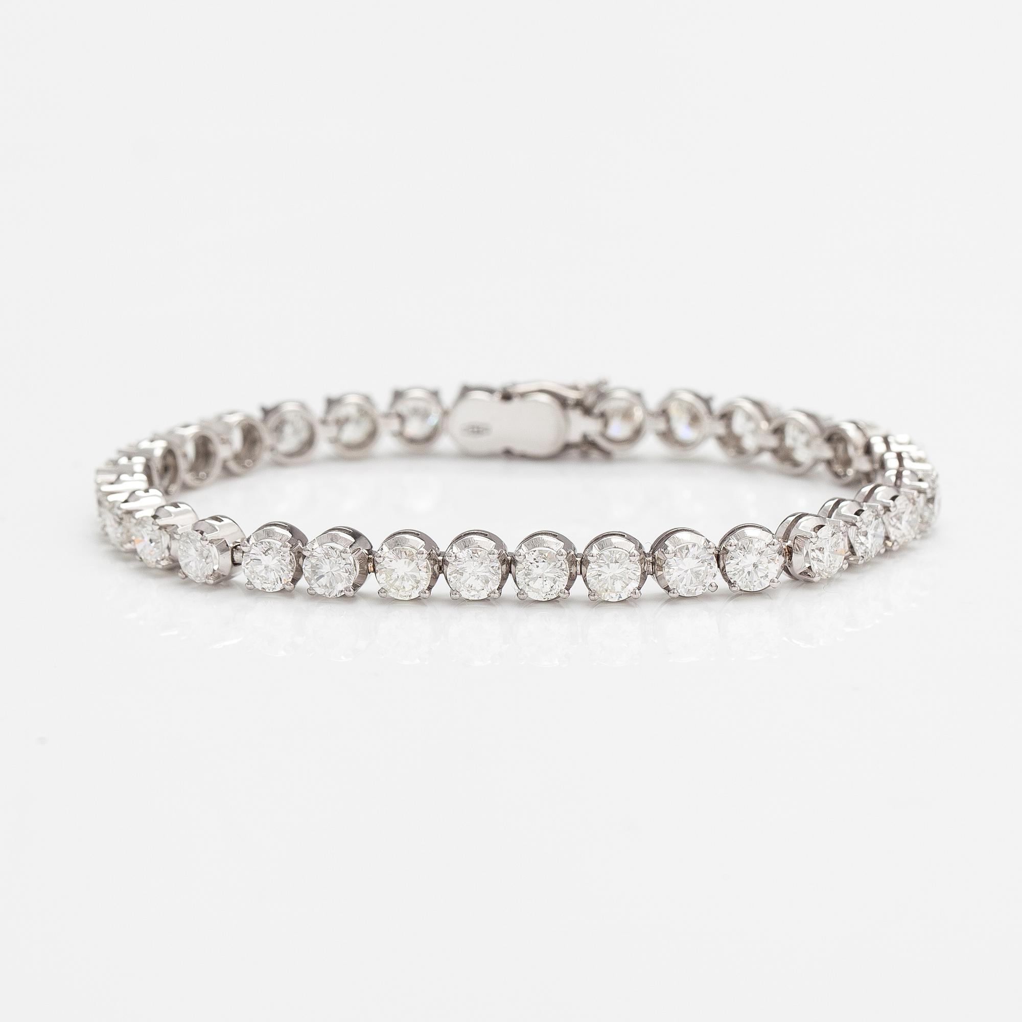 Tennisrannekoru, 18K valkokultaa ja briljanttihiottuja timantteja n. 7.50 ct yht.