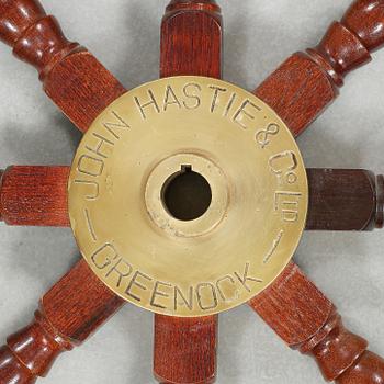 A ship wheel from John Hastie & Co, Greenrock, 20th century.