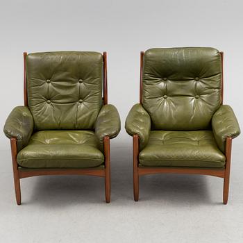 A pair of stained beech and leather easy chairs from Göte Möbler, Nässjö, second half of the 20th century.