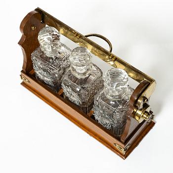A wooden box with three glass flasks, Birmingham, circa 1900.