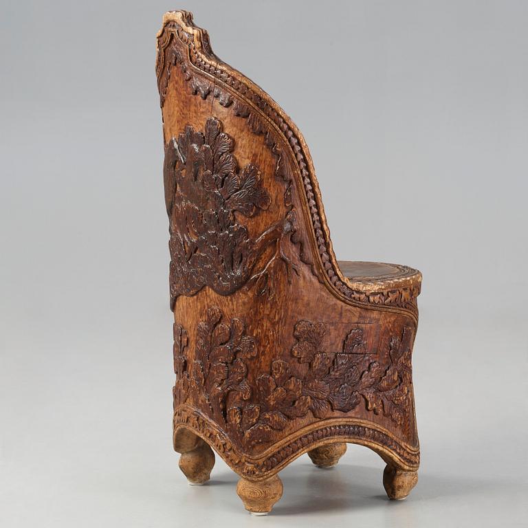 Knut Fjaestad, an Art Nouveau folk art sculptured pine chair, Sweden early 1900's.