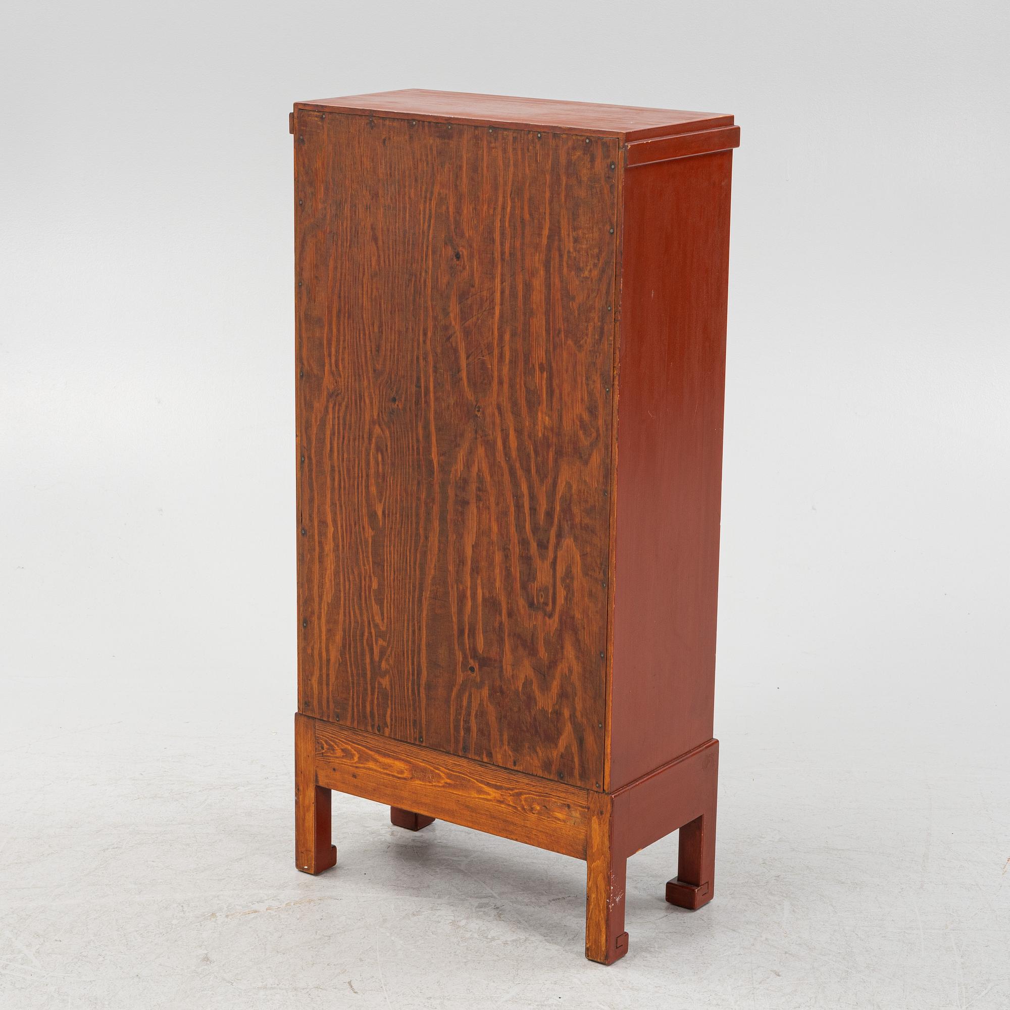 A Chinese cabinet, early 20th Century, with 19th Century carved panels.