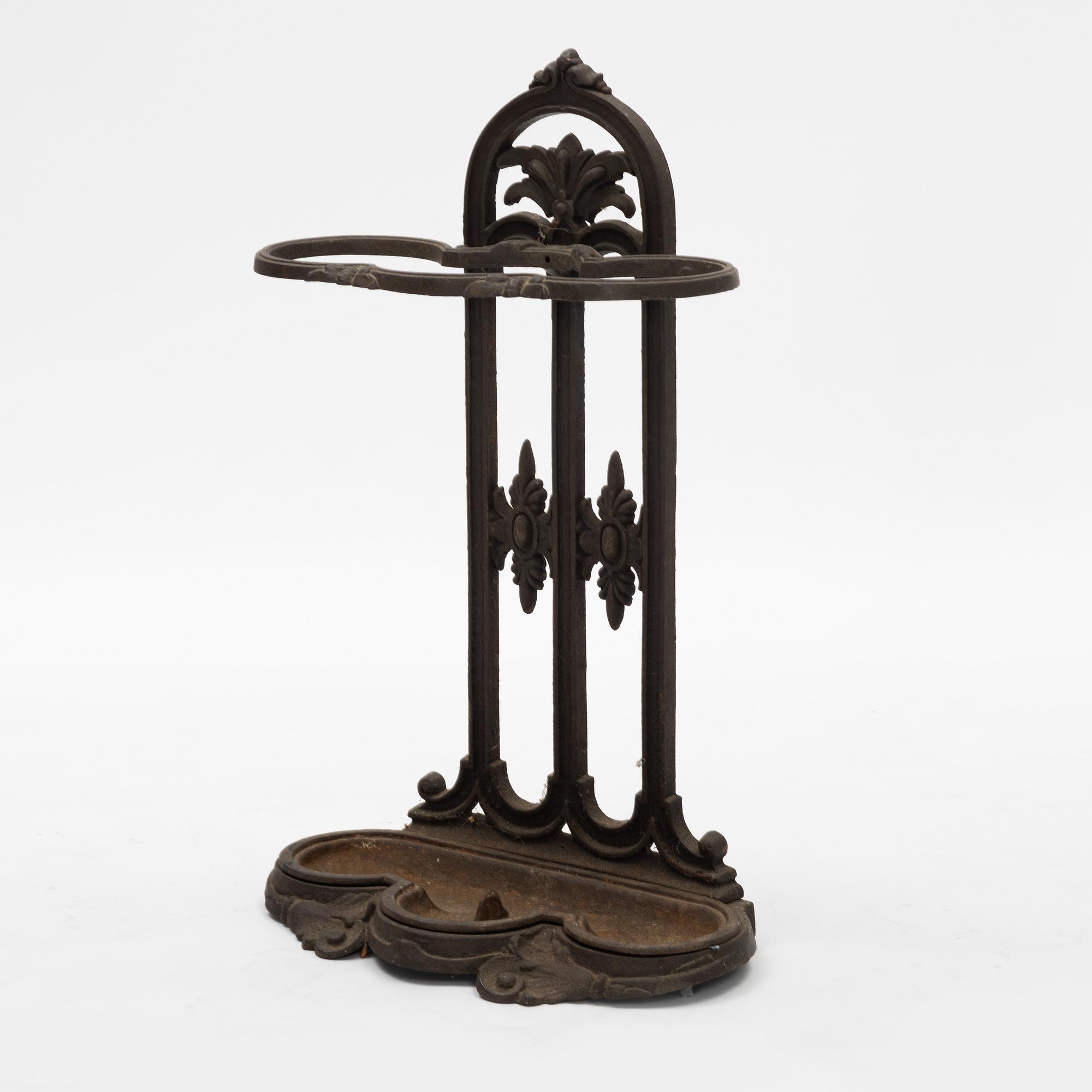 A cast iron umbrella stand, circa 1900.