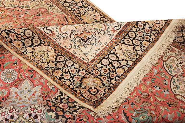 A silk Kashmar carpet, c. 280 x 177 cm.
