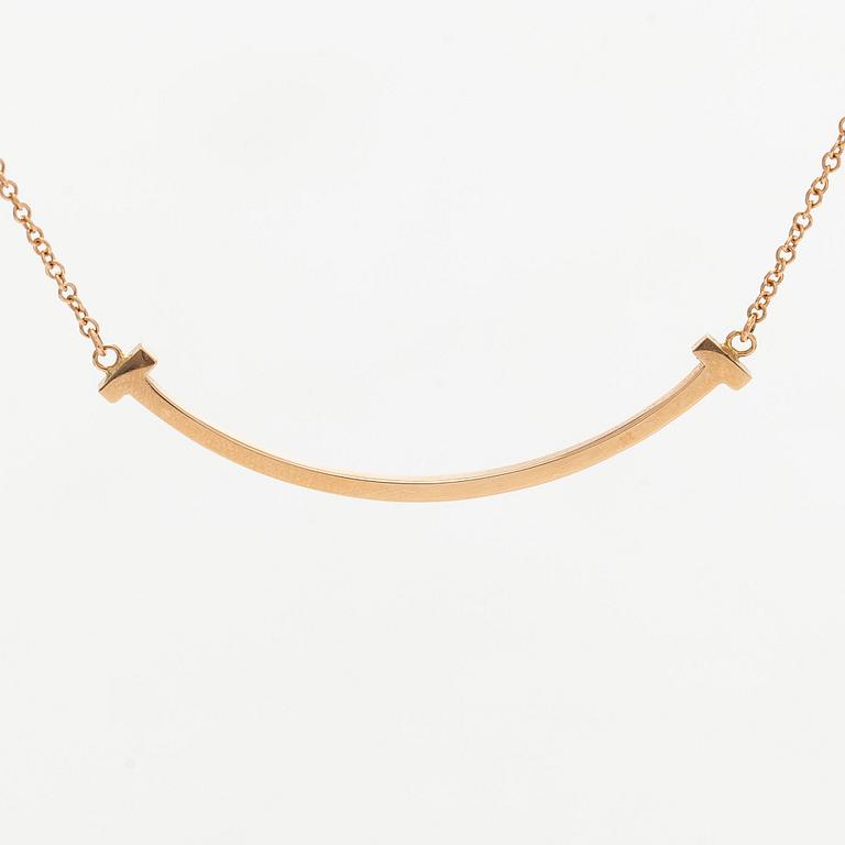 Tiffany & Co, an 18K gold 'T Smile' necklace.