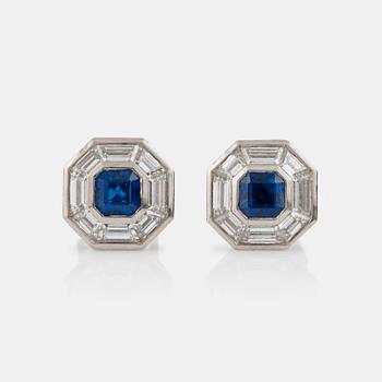1179. A pair of sapphire and step-cut diamond earrings. Total carat weight of diamonds circa 2.00 cts.