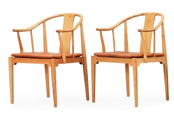 78. A pair of Hans J Wegner cherry and brown leather 'China chairs', Fritz Hansen, Denmark 1988.