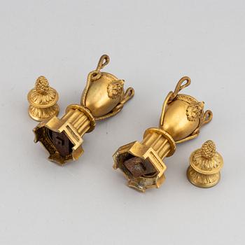 A pair of bronze empire style casolettes from around the year 1900.