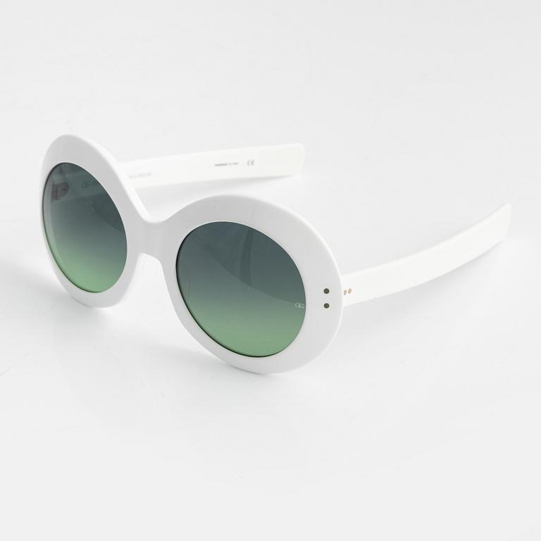 Oliver Goldsmith, a pair of white "Koko" sunglasses.