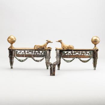 A pair of Louis XVI 18/19 century fire dogs.