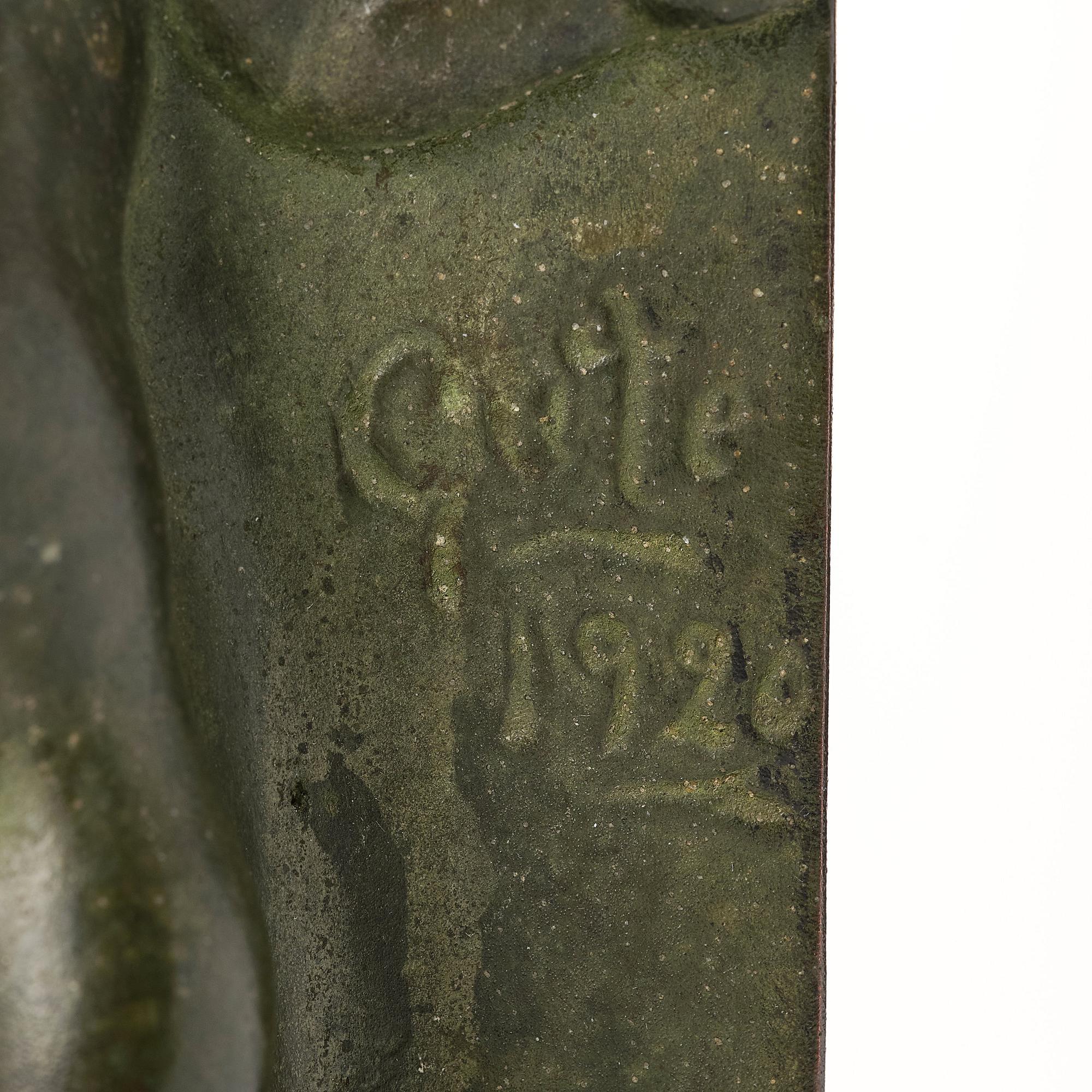 Axel Gute, a pair of green patinated metal bookends, Sweden, dated 1920.
