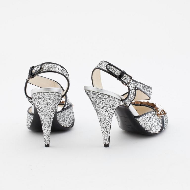 MIU MIU, a pair of glitter embellished leather sandals.