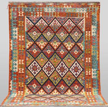 A Kilim rug, approx. 247 x 169 cm.