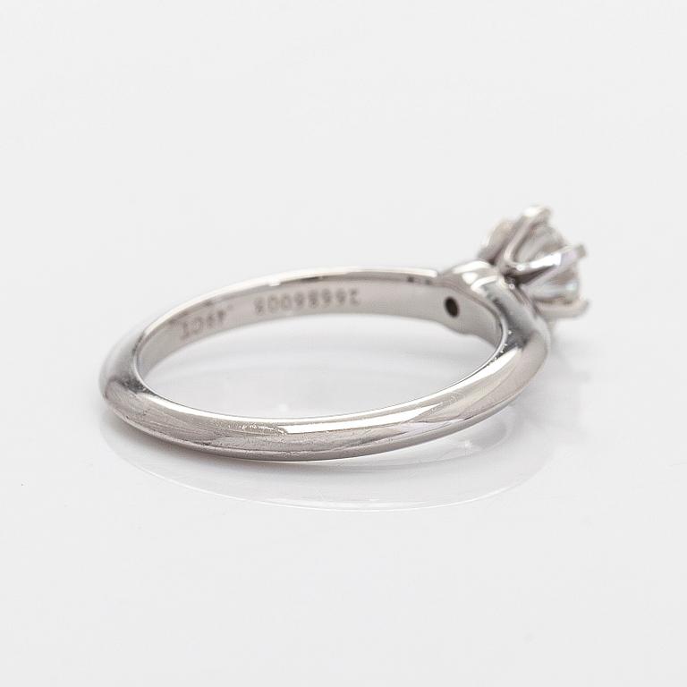 Tiffany & Co, a platinum solitaire ring with a brilliant-cut diamond.