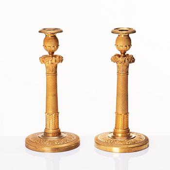 A pair of French Empire candlesticks, early 19th century.