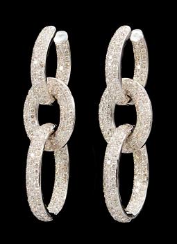 691. A pair of gold and diamond earrings.