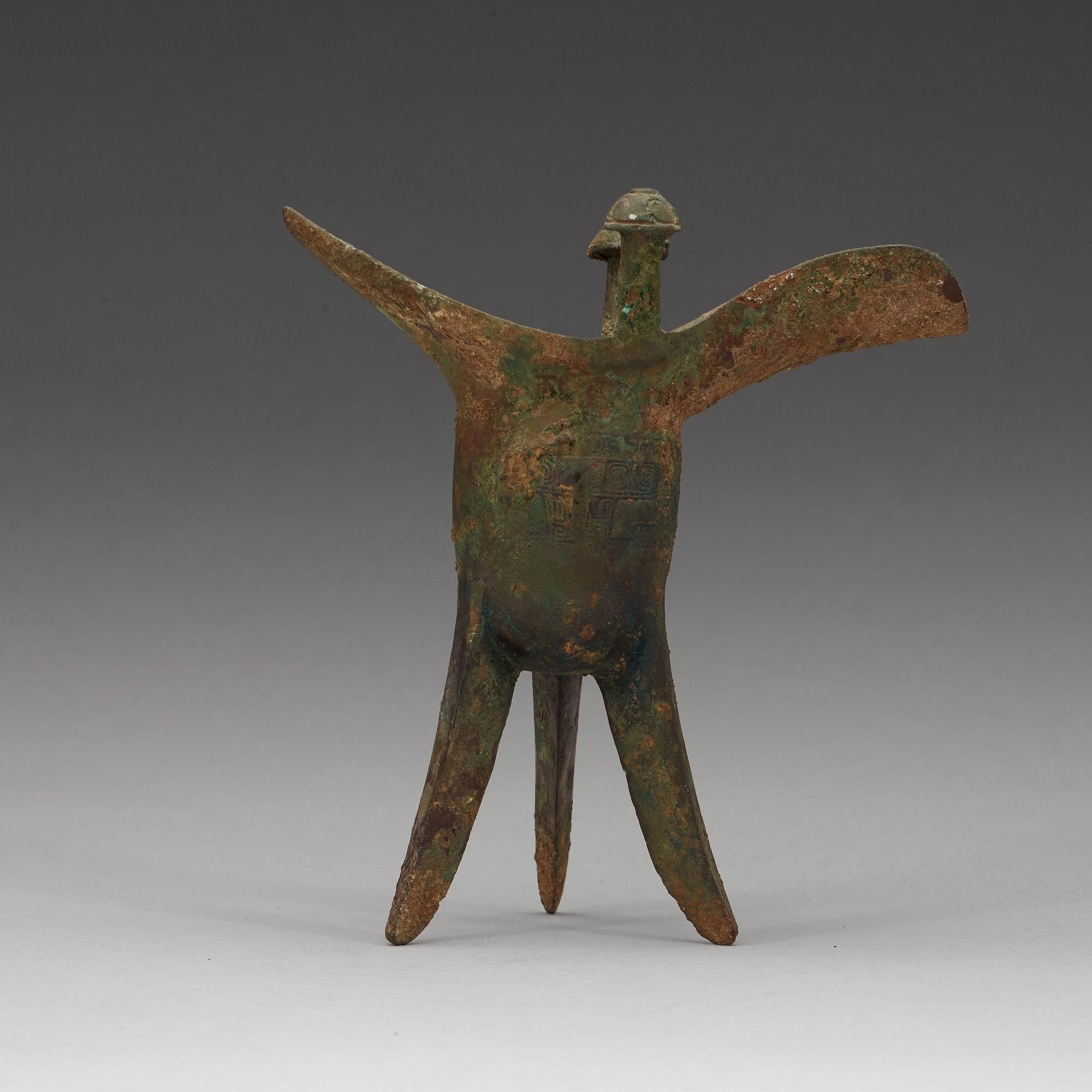 A bronze ritural tripod wine vessel 'Jue', presumably Shang dynasty, 12/11th Century BC.
