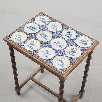 A 20th century Baroque-style table with tiles.