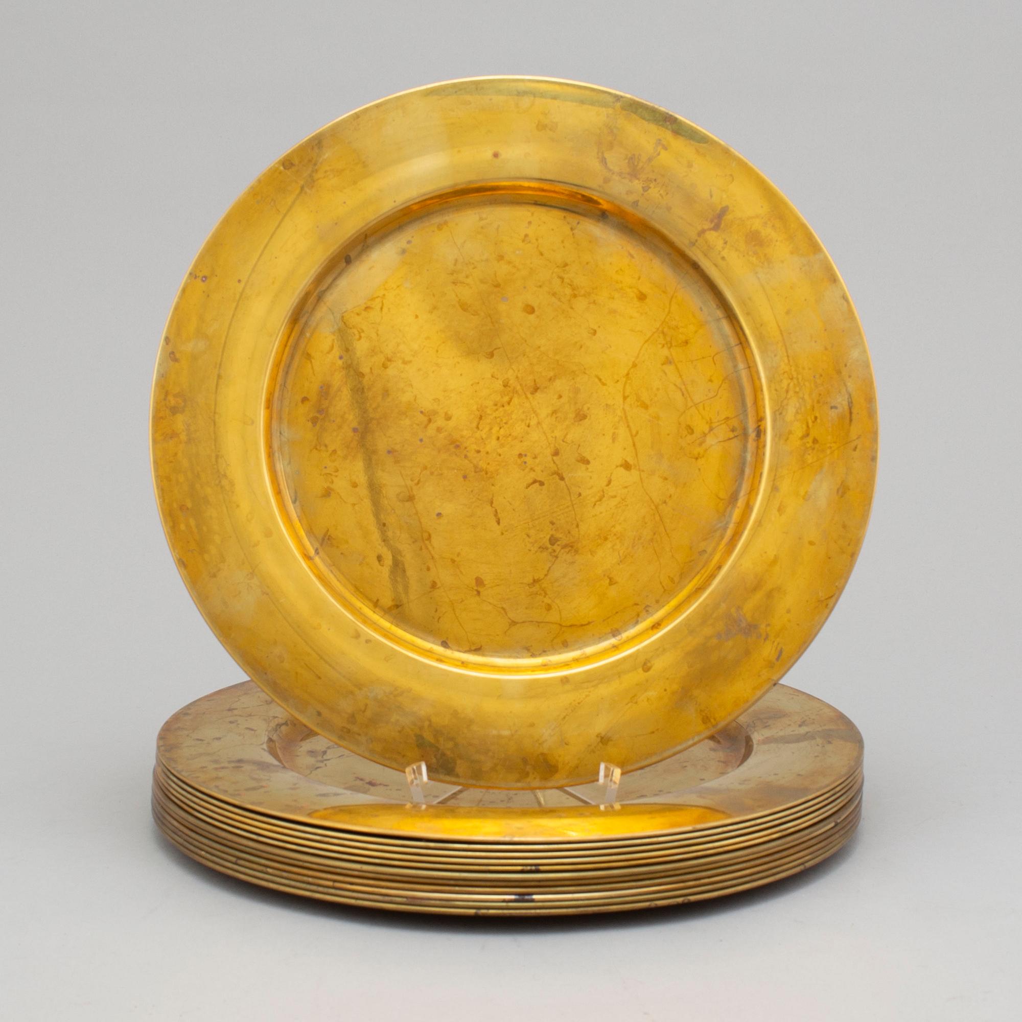 12 brass plates by Stelton, Denmark, second half of the 20th century.