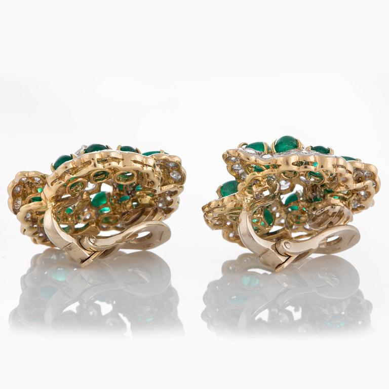 A pair of Bulgari earrings set with cabochon-cut emeralds and round brilliant-cut diamonds.
