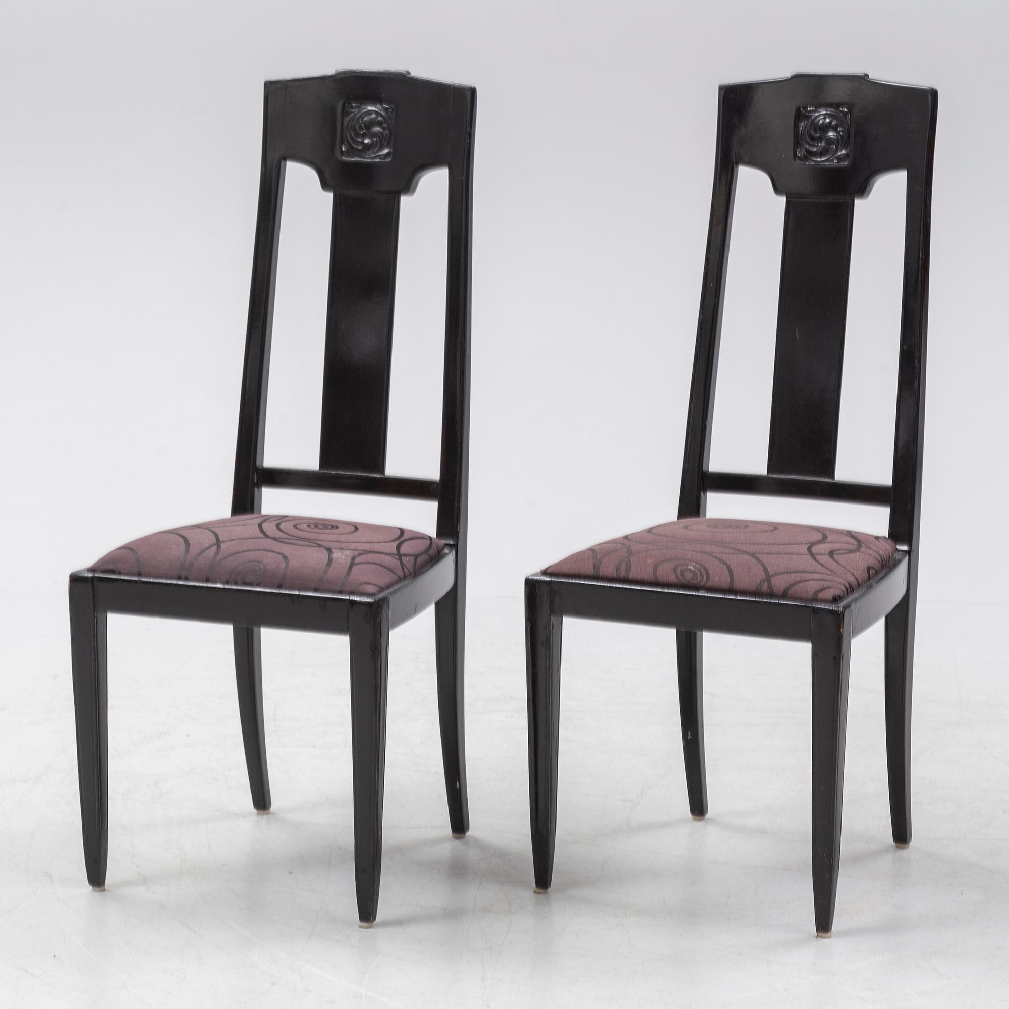 Ten carved oak chairs, Myrstedt & Stern A.-B., Stockholm, early 20th Century.