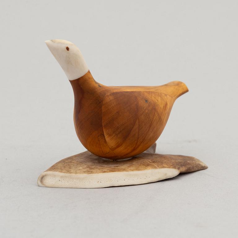 Lars Levi Sunna, a reindeer horn and birch figurine of a grouse, signed.